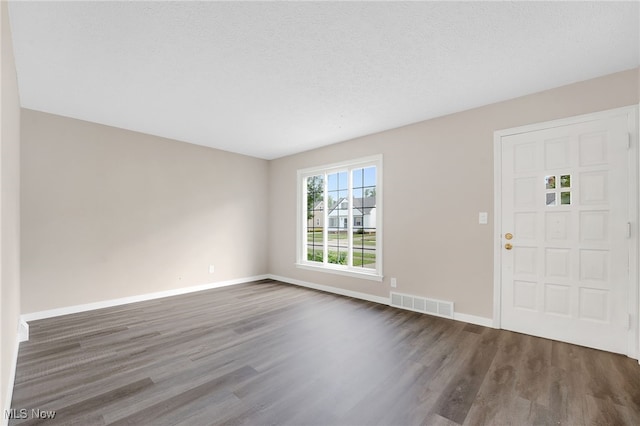 452 E 329th St, Willowick, OH 44095 - foyer entrance featuring wood finished floors and baseboards