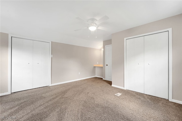 452 E 329th St, Willowick, OH 44095 - unfurnished bedroom with carpet floors, two closets, and a ceiling fan