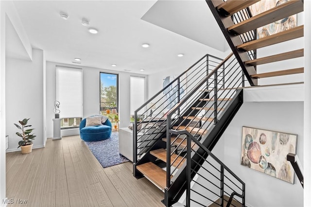 2317 Scranton Rd, Cleveland, OH 44113 - stairs featuring recessed lighting and wood finished floors