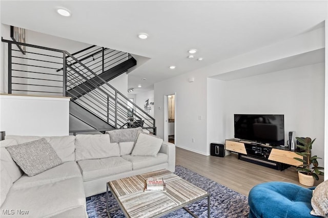 2317 Scranton Rd, Cleveland, OH 44113 - living room featuring wood finished floors, stairway, and recessed lighting