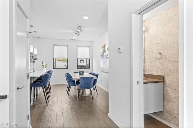 2317 Scranton Rd, Cleveland, OH 44113 - dining space with hardwood / wood-style floors, concrete block wall, and recessed lighting