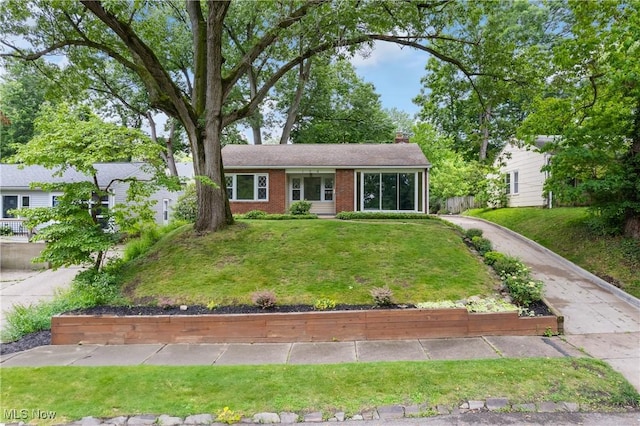 164 Goodview Ave, Akron, OH 44305 - ranch-style home featuring a front lawn, a chimney, and brick siding