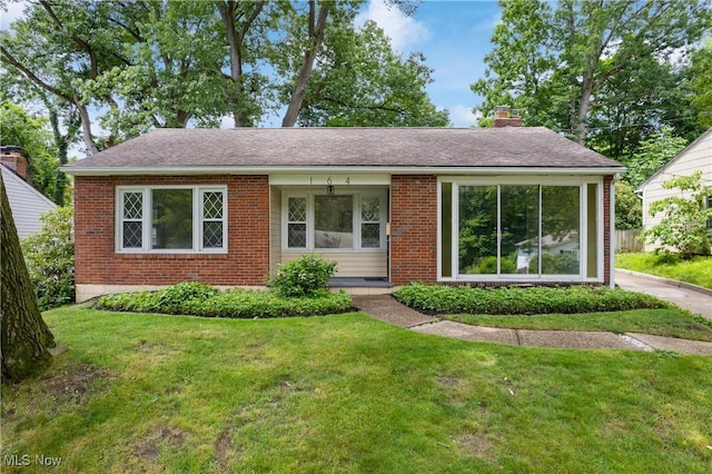 164 Goodview Ave, Akron, OH 44305 - ranch-style home featuring brick siding, a front yard, and a chimney