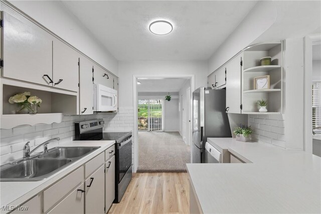 164 Goodview Ave, Akron, OH 44305 - kitchen with open shelves, stainless steel appliances, light wood-type flooring, and light countertops