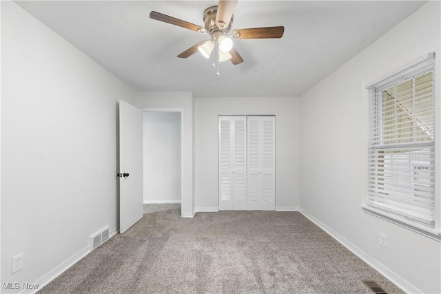 164 Goodview Ave, Akron, OH 44305 - unfurnished bedroom with carpet floors, a closet, and a ceiling fan