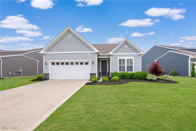 23797 St Andrews Dr, Columbia Station, OH 44028 - view of front facade featuring an attached garage, concrete driveway, a front lawn, and stone siding