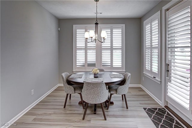23797 St Andrews Dr, Columbia Station, OH 44028 - dining room with a chandelier and light wood-type flooring