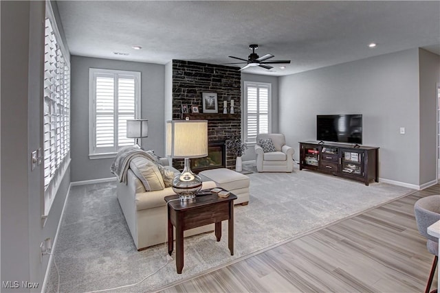 23797 St Andrews Dr, Columbia Station, OH 44028 - living area with ceiling fan, wood finished floors, a fireplace, and recessed lighting