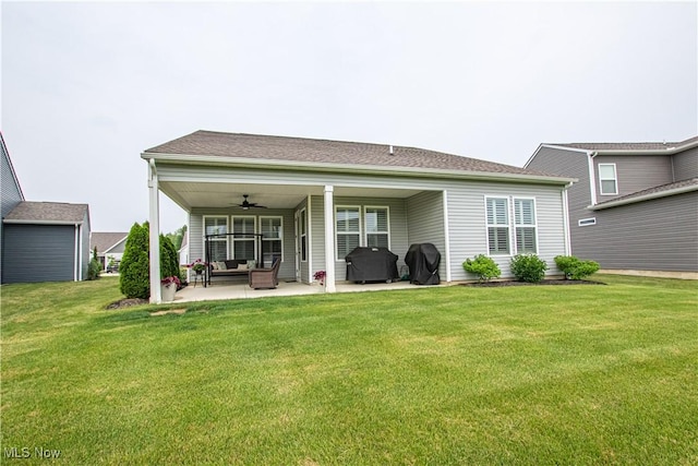 23797 St Andrews Dr, Columbia Station, OH 44028 - back of property featuring ceiling fan, a patio area, a yard, and an outdoor hangout area