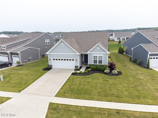 23797 St Andrews Dr, Columbia Station, OH 44028 - traditional-style home featuring a garage, driveway, a front lawn, and a residential view