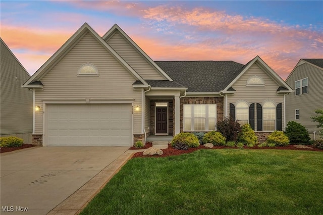 8488 Raya Ln, Streetsboro, OH 44241 - traditional-style home with driveway, a lawn, a shingled roof, and brick siding