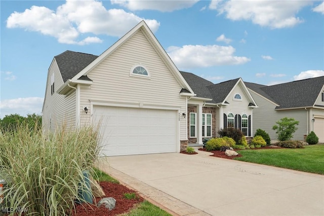 8488 Raya Ln, Streetsboro, OH 44241 - traditional home featuring driveway, roof with shingles, and a front lawn