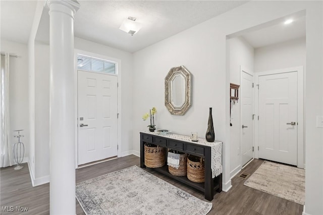 8488 Raya Ln, Streetsboro, OH 44241 - entryway with dark wood-type flooring and ornate columns