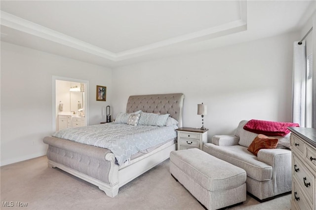 8488 Raya Ln, Streetsboro, OH 44241 - bedroom featuring a tray ceiling, light colored carpet, and ensuite bathroom