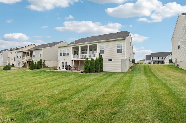 8488 Raya Ln, Streetsboro, OH 44241 - back of property featuring a residential view, a lawn, a patio area, and french doors