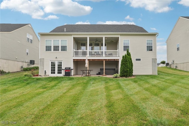 8488 Raya Ln, Streetsboro, OH 44241 - rear view of property with a yard, french doors, and a balcony