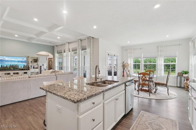 8488 Raya Ln, Streetsboro, OH 44241 - kitchen featuring dishwasher, arched walkways, recessed lighting, a center island with sink, and dark wood-style floors