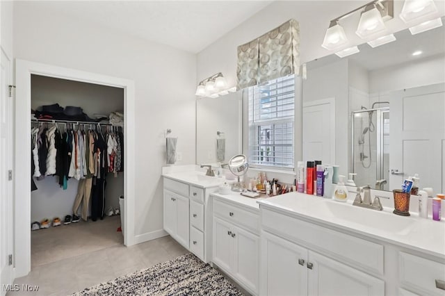 8488 Raya Ln, Streetsboro, OH 44241 - full bathroom featuring a shower stall, vanity, tile patterned floors, and a spacious closet