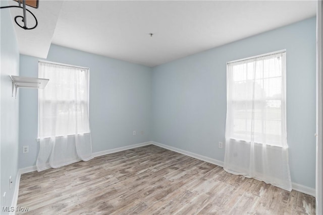 23004 Chandlers Ln Unit 107, Olmsted Falls, OH 44138 - spare room with wood finished floors
