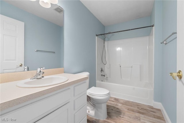 23004 Chandlers Ln Unit 107, Olmsted Falls, OH 44138 - bathroom featuring vanity, wood finished floors, and tub / shower combination