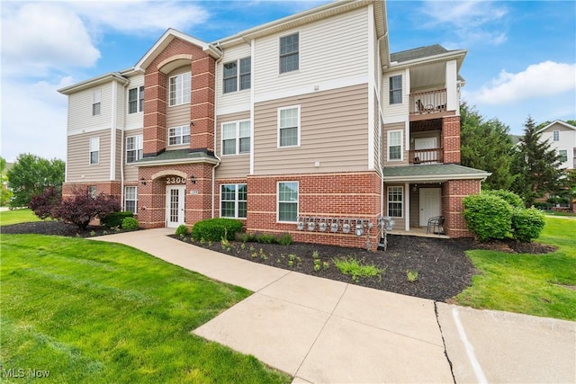 23004 Chandlers Ln Unit 107, Olmsted Falls, OH 44138 - multi unit property featuring brick siding and a front yard