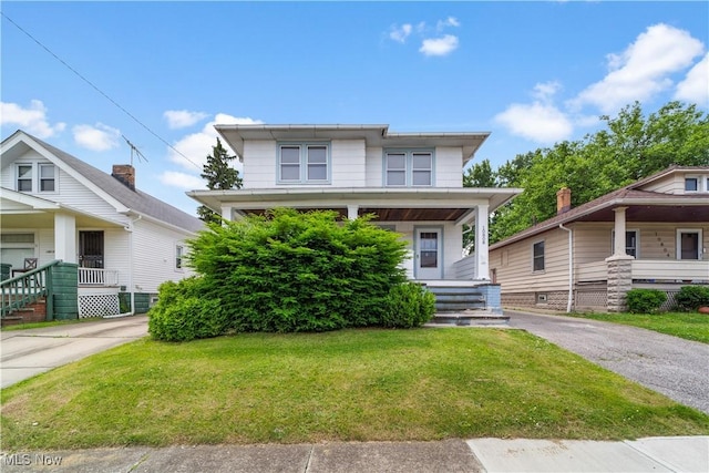 10808 Park Heights Ave, Garfield Heights, OH 44125 - american foursquare style home featuring a porch and a front yard