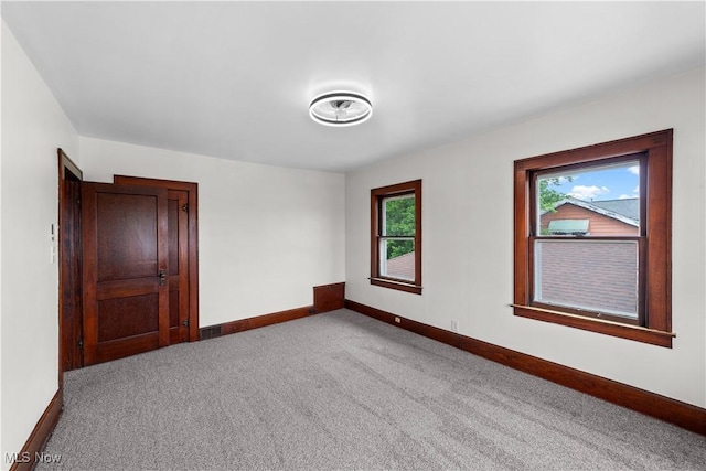 10808 Park Heights Ave, Garfield Heights, OH 44125 - empty room featuring baseboards and carpet floors