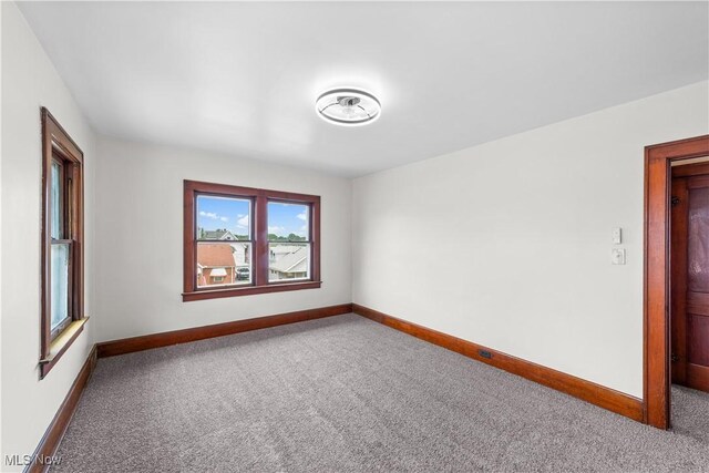10808 Park Heights Ave, Garfield Heights, OH 44125 - carpeted spare room with baseboards