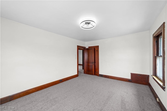 10808 Park Heights Ave, Garfield Heights, OH 44125 - empty room featuring carpet flooring and baseboards