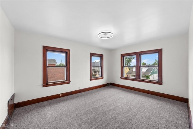 10808 Park Heights Ave, Garfield Heights, OH 44125 - carpeted empty room featuring baseboards