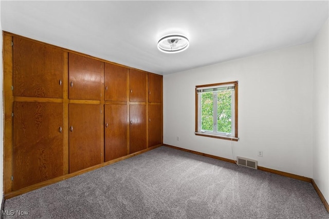 10808 Park Heights Ave, Garfield Heights, OH 44125 - unfurnished bedroom featuring carpet flooring and a closet