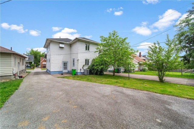 10808 Park Heights Ave, Garfield Heights, OH 44125 - view of front of house featuring asphalt driveway and a front yard