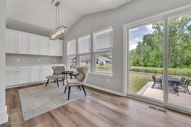 13196 Barrington Dr, Grafton, OH 44044 - living area with vaulted ceiling and light wood finished floors