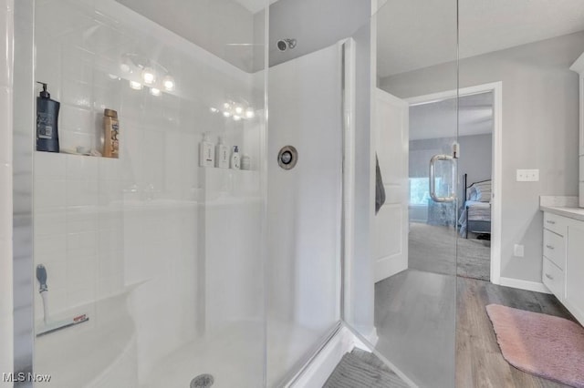 13196 Barrington Dr, Grafton, OH 44044 - ensuite bathroom featuring walk in shower, wood finished floors, and vanity
