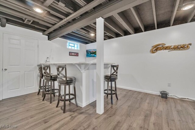 13196 Barrington Dr, Grafton, OH 44044 - basement with bar and wood finished floors