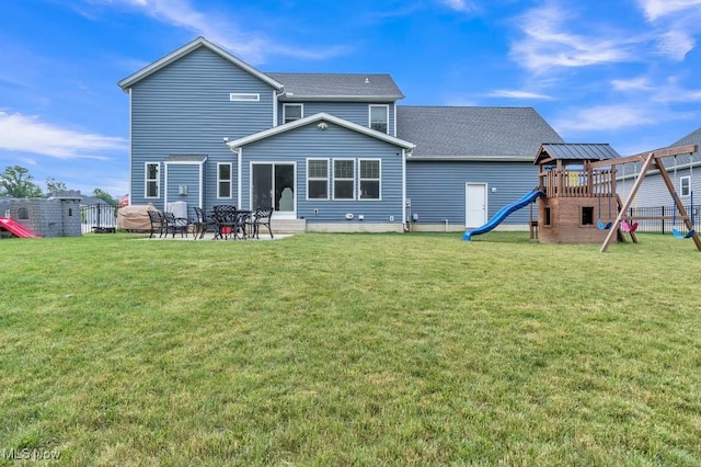 13196 Barrington Dr, Grafton, OH 44044 - rear view of house featuring a playground, roof with shingles, and a patio area