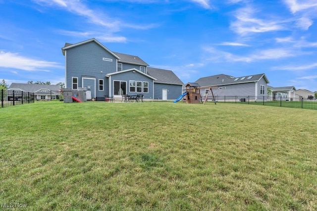 13196 Barrington Dr, Grafton, OH 44044 - back of house with a playground and a fenced backyard