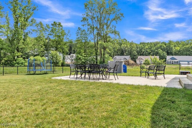 13196 Barrington Dr, Grafton, OH 44044 - view of yard featuring a patio and a trampoline
