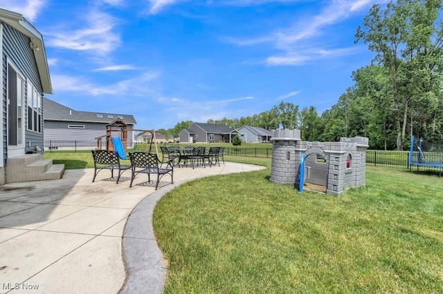 13196 Barrington Dr, Grafton, OH 44044 - view of yard featuring a patio, a trampoline, and a residential view