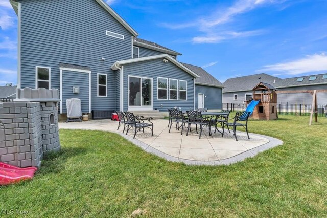 13196 Barrington Dr, Grafton, OH 44044 - back of house featuring a playground and a patio