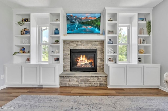 13196 Barrington Dr, Grafton, OH 44044 - living area featuring wood finished floors and a fireplace