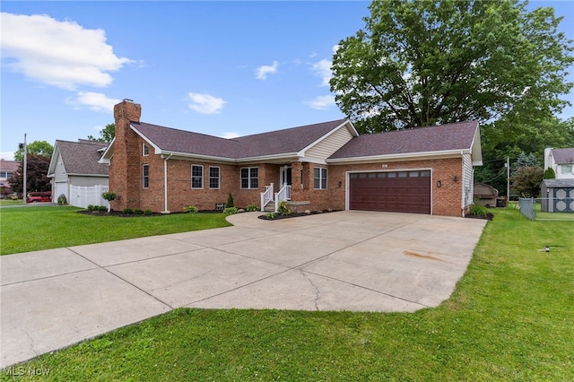 381 Lauretta Ln, Hubbard, OH 44425 - single story home with brick siding, driveway, a garage, a chimney, and roof with shingles