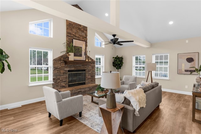 381 Lauretta Ln, Hubbard, OH 44425 - living area featuring high vaulted ceiling, a ceiling fan, wood finished floors, a stone fireplace, and recessed lighting