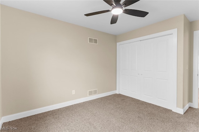381 Lauretta Ln, Hubbard, OH 44425 - unfurnished bedroom featuring light carpet, a closet, and a ceiling fan