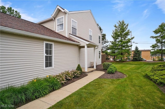 235 Steeple Chase Run Unit 4, Northfield, OH 44067 - view of property exterior with a yard and a shingled roof