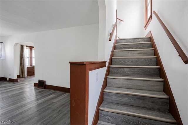 1145 Herberich Ave, Akron, OH 44301 - staircase featuring arched walkways and wood finished floors