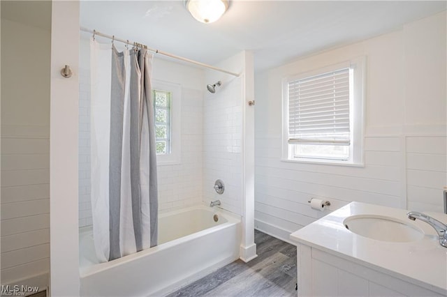 1145 Herberich Ave, Akron, OH 44301 - full bath featuring shower / bath combination with curtain, plenty of natural light, wood finished floors, and vanity