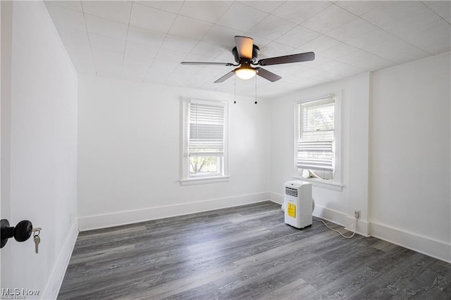 1145 Herberich Ave, Akron, OH 44301 - empty room featuring ceiling fan and dark wood-style flooring