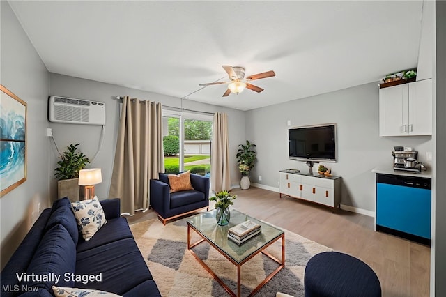 1372 Golden Gate Blvd, Mayfield Heights, OH 44124 - living room with ceiling fan, a wall mounted air conditioner, and light wood-style floors