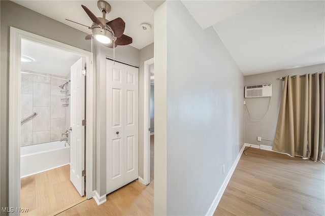 1372 Golden Gate Blvd, Mayfield Heights, OH 44124 - hallway with light wood finished floors and a wall unit AC